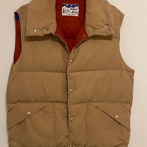 Down feathers Tan Puffer Vest, has some repair to pockets. Nice structure